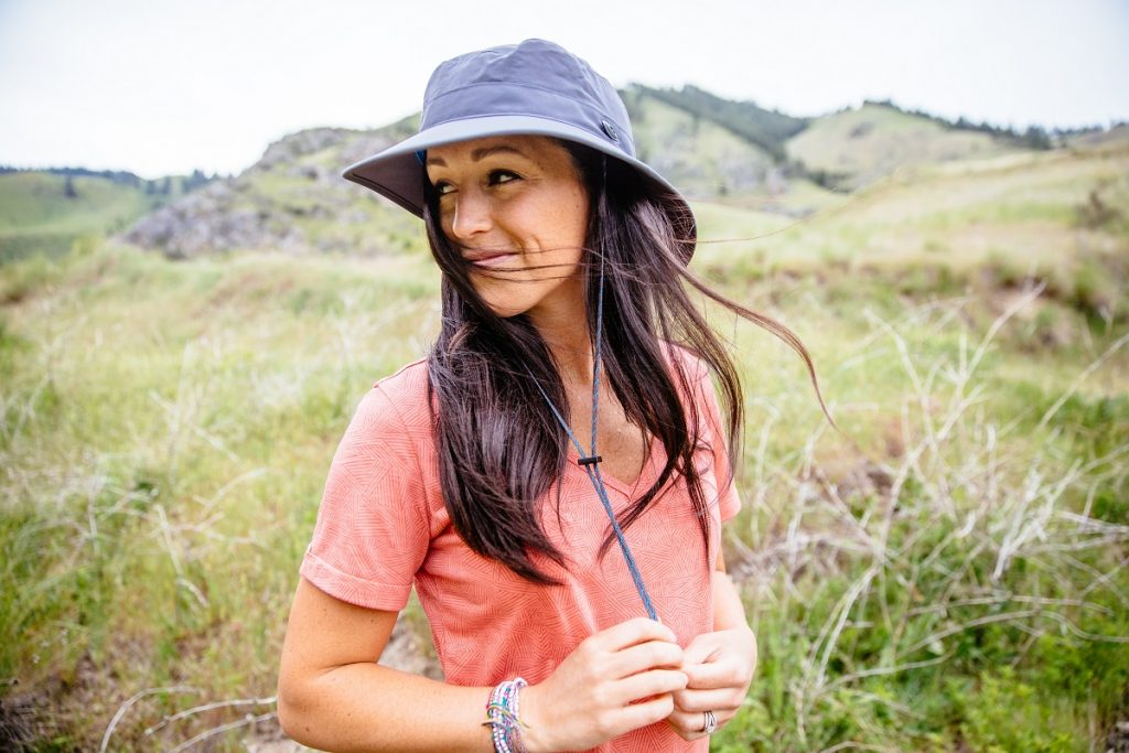 woman in K&Uuml;HL Inara shirt and K&Uuml;HL Sun Blade Hat in the outdoors